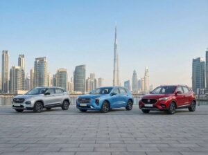 three cars parked in car rental with Dubai background